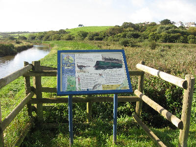Interpretation board beside old railway bridge