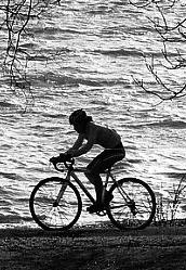 cyclist beside water.jpg