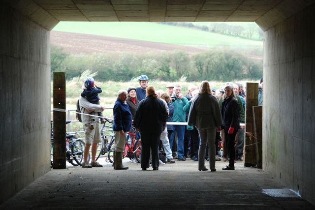 cutting the ribbon to open the underpass